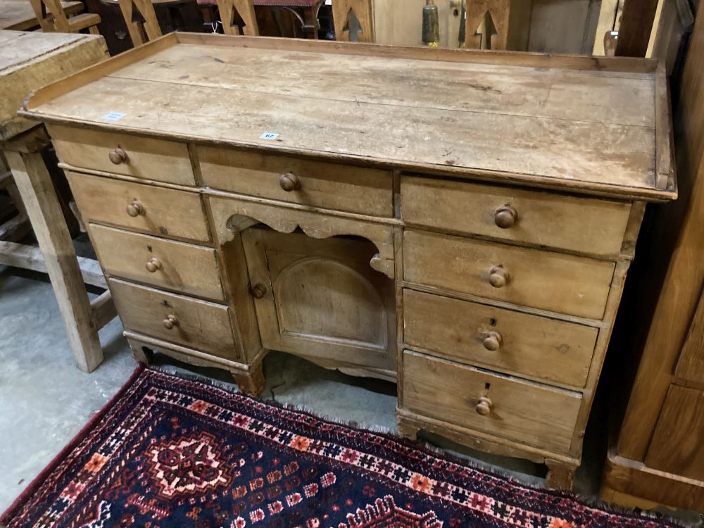 A Victorian pine kneehole desk, width 128cm depth 55cm height 82cm